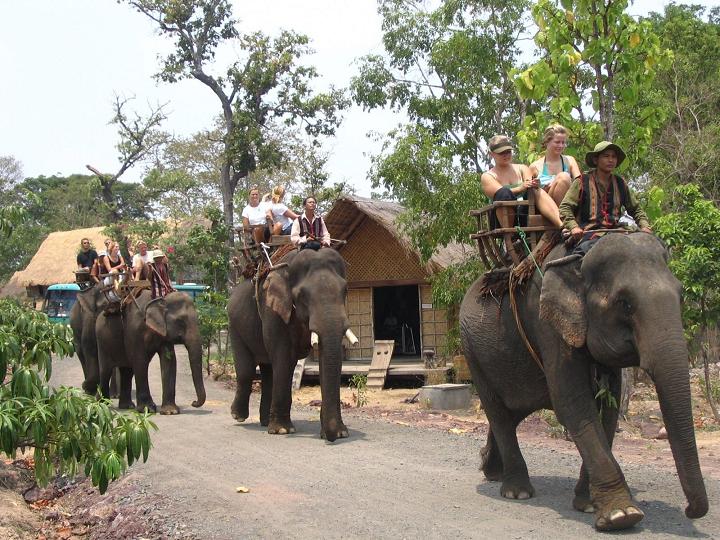 Riding elephant in Don village